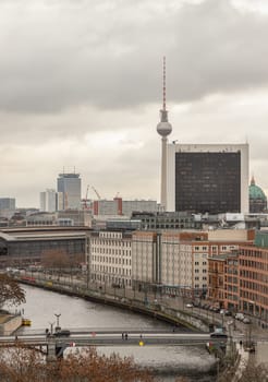 Berlin, Germany - Dec 20, 2023 - Berlin cityscape view from above of Reichstag building with Berlin TV-Tower, Berliner Dom, Marschall Bridge, River Spree and buildings at the downtown Berlin. a major tourist attraction of the berlin city, Space for text, Selective focus.