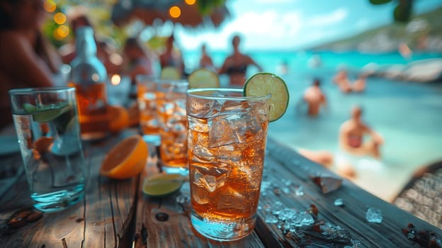 A close-up of a glass of iced tea with a lime wedge, sitting on a wooden table at a beach bar. The drink is surrounded by other glasses, and the ocean and beach are visible in the background. People are swimming and relaxing in the water, enjoying the beautiful day.