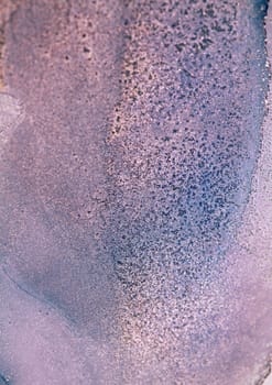 A close-up image of a purple and blue ink swirl, showcasing a textured, abstract pattern.