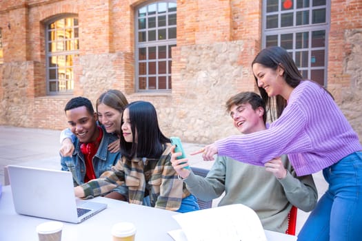 Group of students, meet on university campus work together on creative tasks, prepare for university exams, use laptop. Education, study of university life concept.