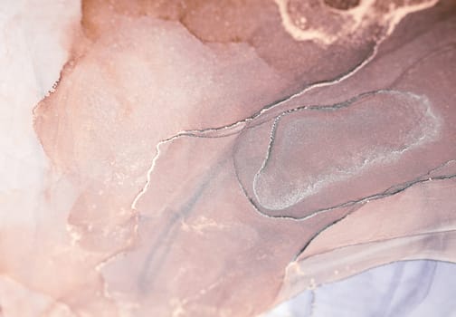 A close-up of an abstract painting created with alcohol ink. The colors are mainly shades of pink and brown, with hints of silver, creating a unique and captivating artwork.