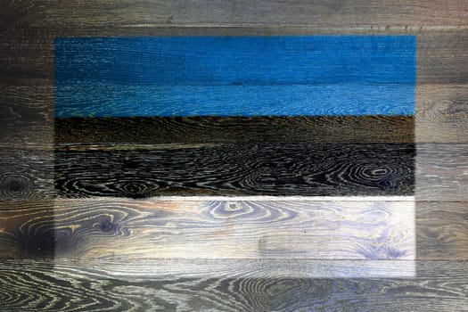 An Estonia flag on rustic old wood surface background