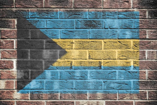 A Bahamas flag on a brick wall background
