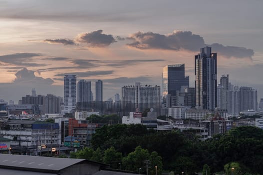 Bangkok, Thailand - 29 May 2024 - Beautiful Clouds in the Sky over Large Metropolitan City of Bangkok. View of Skyscrapers and Dramatic Sky before Sunset, Space for text, Selective focus.