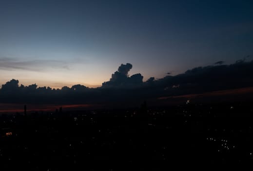 Bangkok, Thailand - 15 Jun, 2024 - Silhouette of skyline view. Twilight sky in the Evening with dark clouds on silhouette of the city, Natural atmosphere night sky, Copy space, Selective focus.
