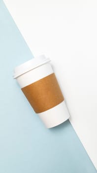 Mockup Paper Drinks Mug, Cup with White Lid and Corrugated Sleeve On White and Blue Background. Eco Hot Beverage Tumbler, Vertical Plane, Copy Space. On the Go Food Service Application.