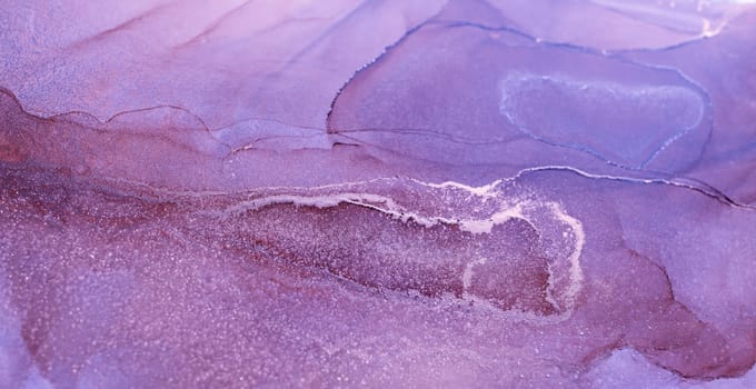 A close-up of an abstract painting featuring swirling patterns of purple and silver ink, creating a fluid and ethereal effect.