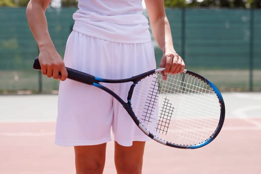 young woman playing tennis on the tennis court, olympic sport, outdoor activity concept