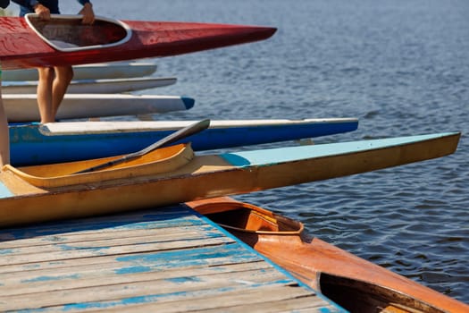 athlete putting on water kayak, water sport, kayaking and canoeing, olympic games, rowing competition