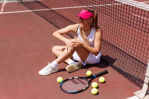 a young tennis player was injured while playing tennis, big tennis concept, sports injuries