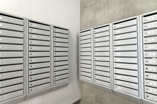 mailboxes in the interior of entrance group of residential high-rise building, Russia