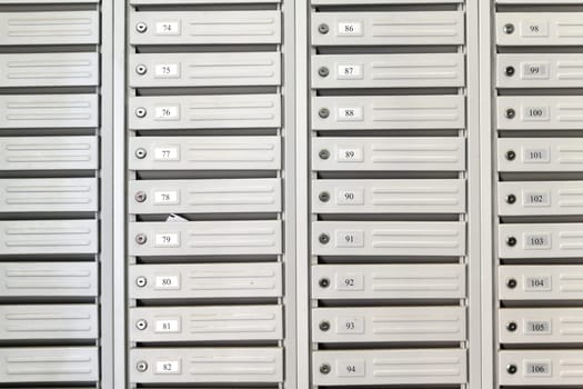 mailboxes in the interior of entrance group of residential high-rise building, Russia