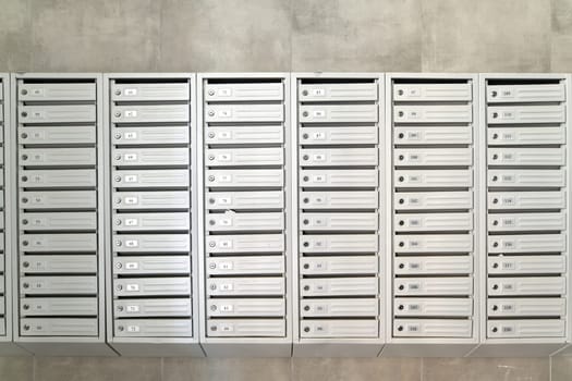 mailboxes in the interior of entrance group of residential high-rise building, Russia