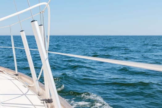 Turnbuckle aluminum covers on a classic sailboat on the side deck. Summer adventure, open sea with waves, recreation, cruise, vacations, regatta, sport in Finland, Gulf of Finland.