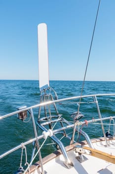 Wind vane Monitor - wind autopilot on a stern of yacht sailing on a sunny summer day in the Gulf of Finland.