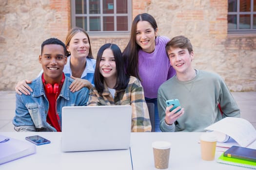 Group of students, meet on university campus work together on creative tasks, prepare for university exams, use laptop. Education, study of university life concept.