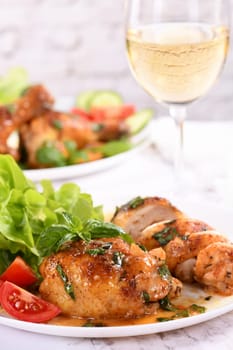 Chicken thigh with gravy and vegetable side dish