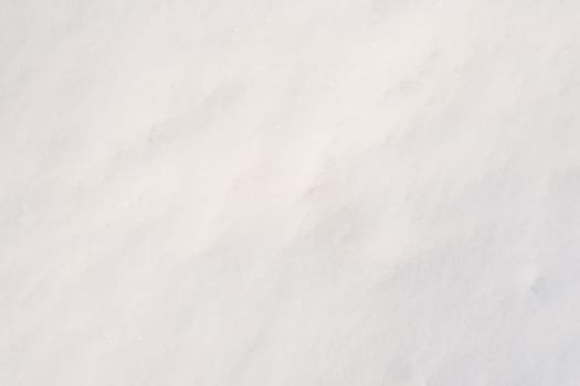 Snow surface close-up in sunny weather. Snow texture close-up.