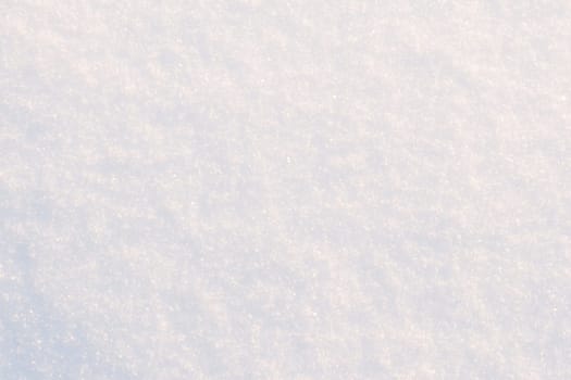 Snow texture close-up. White frost snow toned in blue background.