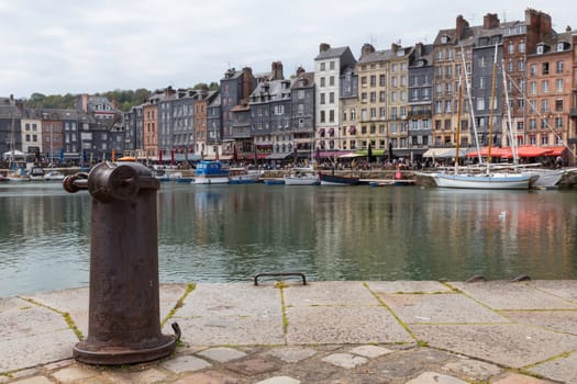 Honfleur, Normandy, France - 25-04-2024: People Sitting on the Terrace of the Restaurant. Port of Honfleur in the Calvados department in northwestern France