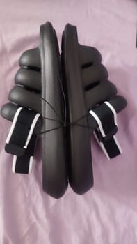 black rubber flip flops shoes slippers. High quality photo