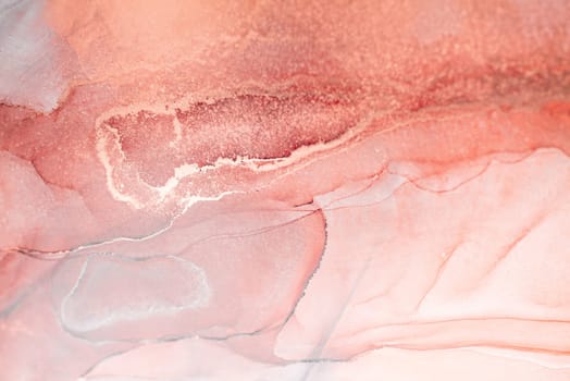 A close-up photograph showcasing abstract art in shades of blush pink and white. The flowing ink creates a gentle swirl of color.