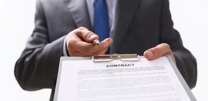 Close-up of partnership agreement, realtor give contract paper with pen to sign. Agreed on business conditions, put signature on list. Agreement concept
