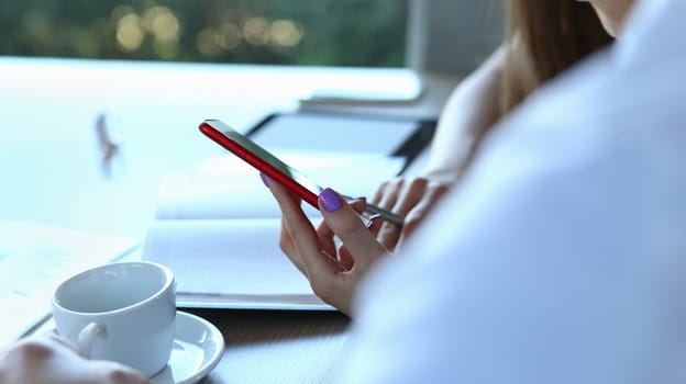 Close-up of woman hold smartphone, typing message, calling someone, modern device for communication. Technology, gadget, digital world, development concept