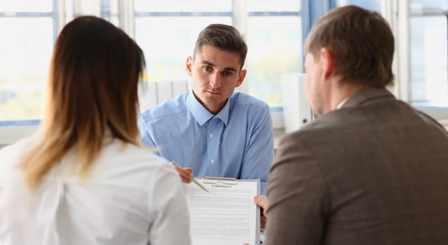 Portrait of man worker in suit give contract paper to clients, agreement terms, put signature. Prepared business document for client. Deal, lawyer concept