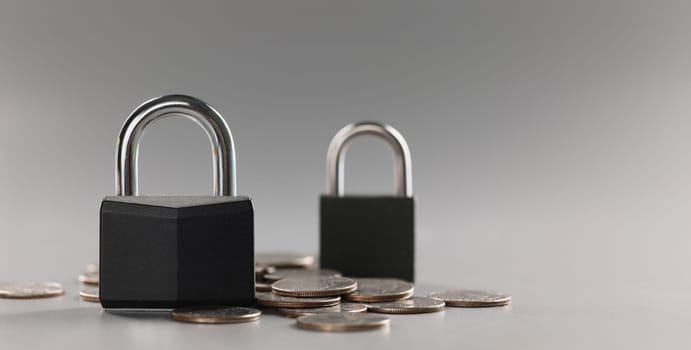 Close-up of combination padlock on coin money for financial security, symbol for protection finance. Keep savings in secure place. Security, safety concept