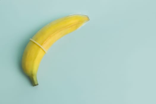 Sex education and safe sex. Banana and condom concept of the penis in contraception.