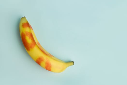 Blow job . A banana decorated with traces of red lipstick. Oral Sex and Concept.