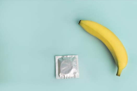 Sex education and safe sex. Banana and condom concept of the penis in contraception.