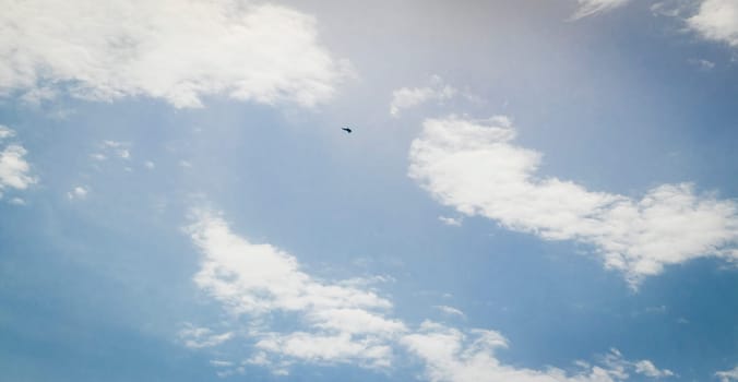 Silhouette of the MIG fighter jet in the cloudy sky