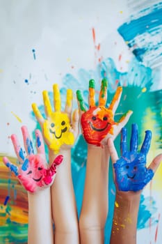 Children's hands in the colors of summer. Selective focus. arts