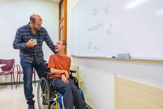 Brainstorming meeting of a man with disability and a colleague in the university
