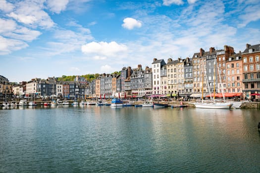 Honfleur, Normandy, France - 25-04-2024: People Sitting on the Terrace of the Restaurant. Port of Honfleur in the Calvados department in northwestern France
