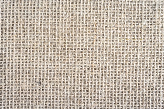 Abstract background, close up photo from a piece of Burlap fabric.