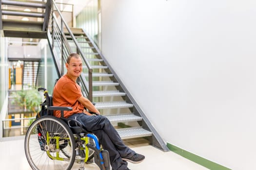Man with cerebral palsy on a coworking during a work break