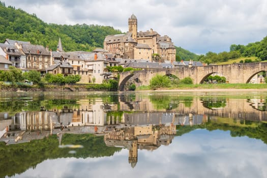 Estaing village, castle and medieval bridge over Lot river photographed in Aveyron, one of the most beautiful villages of France
