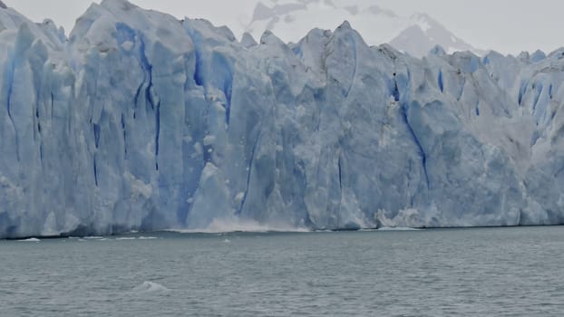 Stunning slow-mo video shows huge iceberg breaking from Perito Moreno Glacier into Argentine Lake.