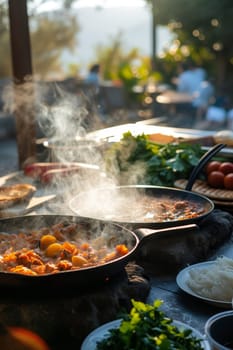 Evening light filters through steam rising from sizzling dishes being prepared outdoors