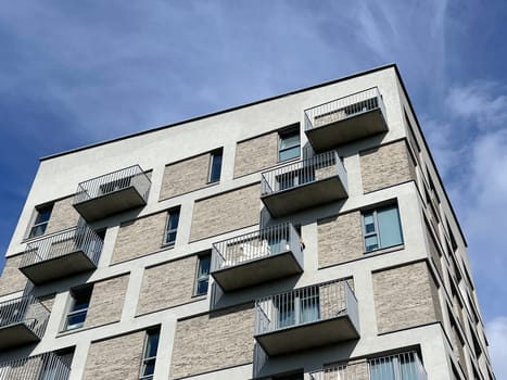 Modern and new apartment building. Multistoried modern, new and stylish living block of flats. High quality photo