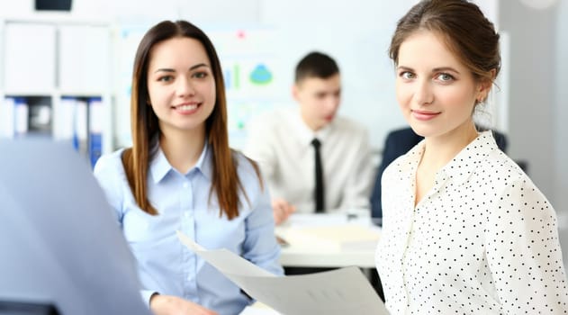 Group of modern businesspeople in office debate on financial issue hold in arms documents portrait. Success assessment human resources data analysis person