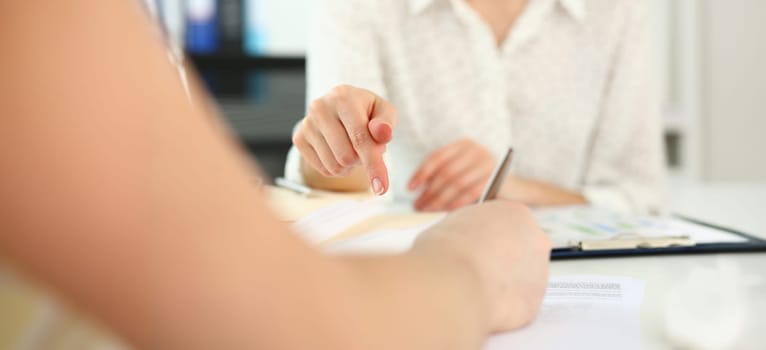 Female arm offer contract form touch finger to sign closeup. Strike bargain for profit white collar motivation union decision corporate executive sale insurance agent concept