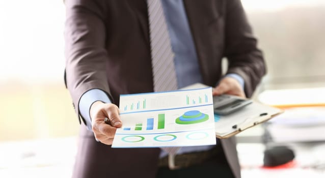 Booker do Consulting Job Calculation Income Money. Businessman Accounting Revenue with Data on Colour Paper Chart. Business Banking Strategy Concept. Payment Expenses and Invoice Balance