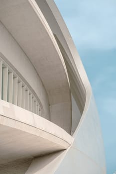Close-up of a building showcasing architectural curves and lines. The design elements reflect modern urban architecture and innovative construction techniques.