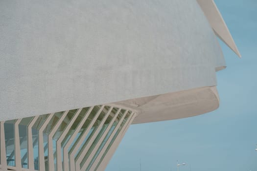 Detailed view of a building innovative facade with large windows and intricate design elements. The modern architecture highlights structural creativity and functionality.