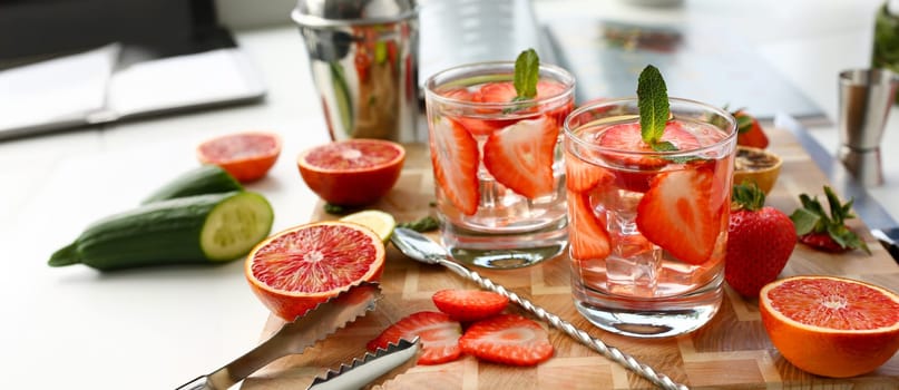 Strawberry punch home made cocktail closeup on wood background