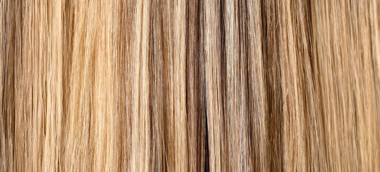 Woman hair dyeing in salon closeup pattern background